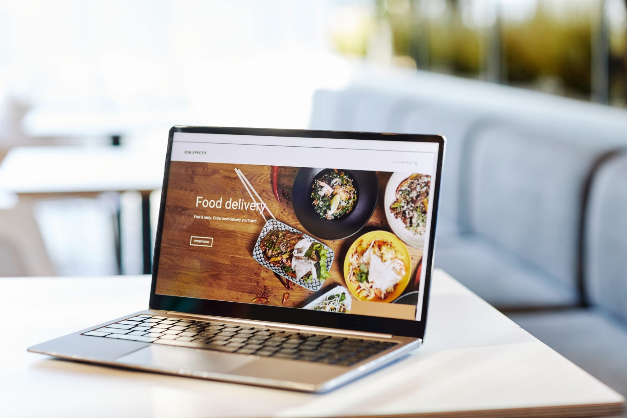 Laptop showing a food website.